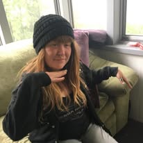 A loved one sitting by a window