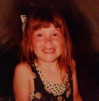 A childhood photo of a loved one smiling