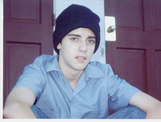 A younger loved one sitting on a porch