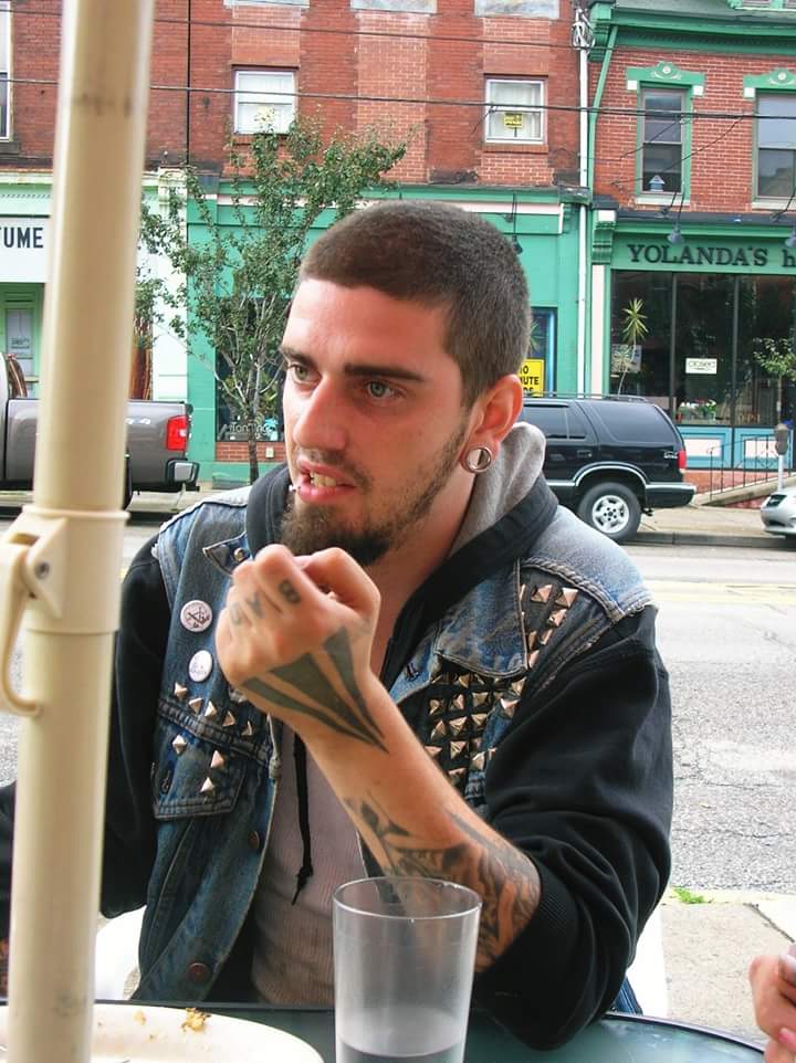 A loved one sitting at an outdoor table