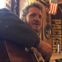 A loved one holding a guitar