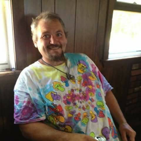 A loved one smiling in a colorful shirt